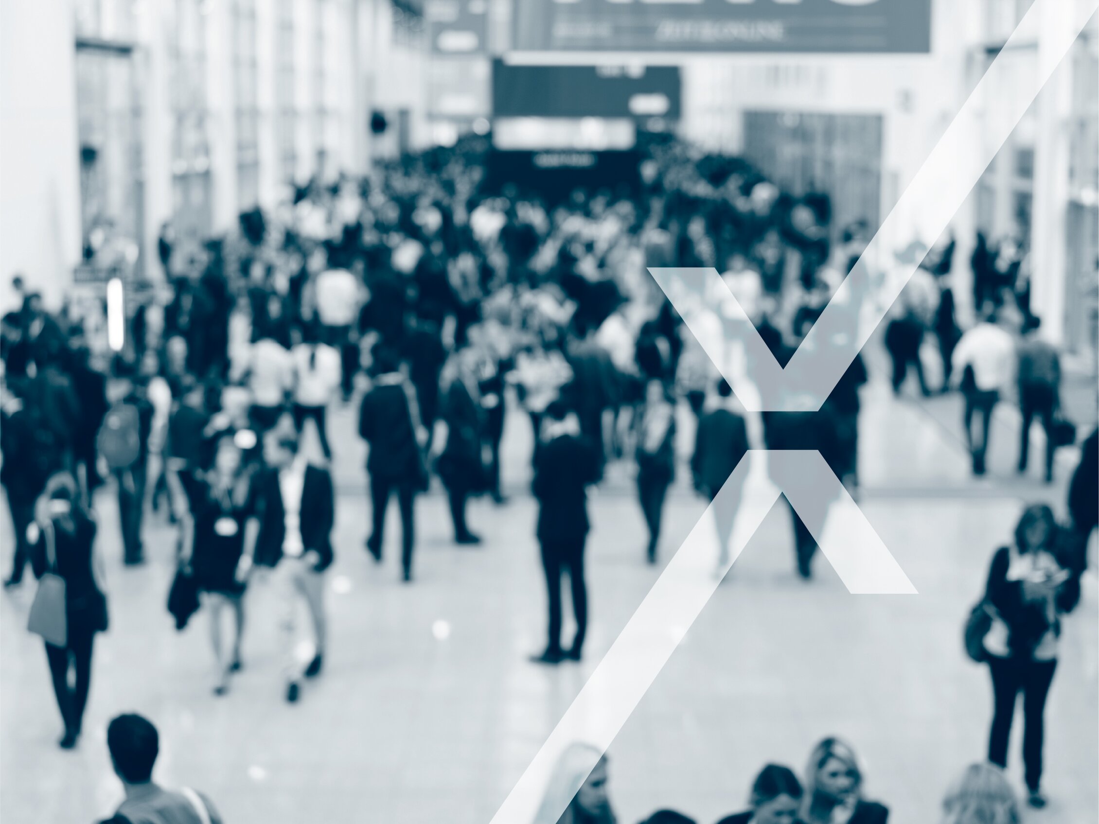 A large number of visitors attend a trade fair, with the IEG Deutschland logo in the foreground